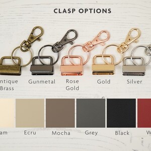 May include: Five different metal clasps with key rings in antique brass, gunmetal, rose gold, gold, and silver. Below the clasps are six color swatches labeled cream, ecru, mocha, grey, black, and wine.