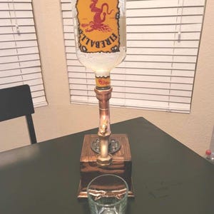 Copper pipe liquor dispenser