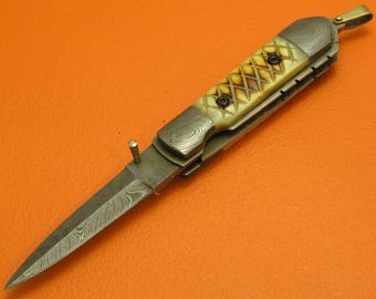 Handmade Damascus Steel Folding Knife, Engraved Flamed Camel Bone, Handle, Cowhide Sheath