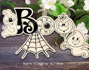 May include: A wooden sign with the word "BOO" spelled out in a whimsical style. The letters are decorated with a ghost, spider, eye, pumpkin, and spider web. The sign is 10 inches high by 16.7 inches wide.