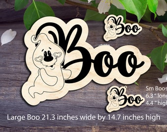 May include: Two wooden cutouts of a ghost saying "Boo" in black lettering. The larger cutout is 21.3 inches wide by 14.7 inches high. The smaller cutout is 6.3 inches long by 4.4 inches high.
