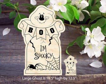 May include: A wooden cutout of a ghost with a banner that says "BOO" and a tombstone that says "I'm Spooky". The ghost is 18.5 inches high and 12.5 inches wide.