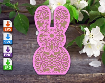 May include: A pink laser-cut bunny shape with intricate floral patterns, set against a tan background. The bunny is displayed on a rustic wooden surface, with white flowers and green leaves in the background. The image also includes EPS, SVG, PNG, and JPG file type icons.