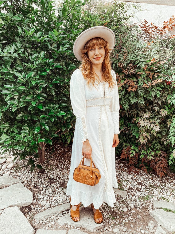 white dress with brown sandals ON ISLAND TIME RUFFLED MINI DRESS IN WHITE – AKIRA main image 0