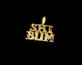 vintage ski bum 14k yellow gold charm pendant