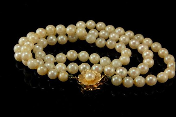 Pearls with 2024 gold clasp