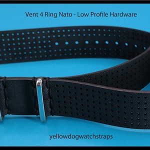 May include: Black Vent 4 Ring NATO watch strap with low profile hardware. The strap has a perforated design and stainless steel buckles. The text "Vent 4 Ring NATO - Low Profile Hardware" is at the top. The text "yellowdogwatchstraps" is at the bottom.