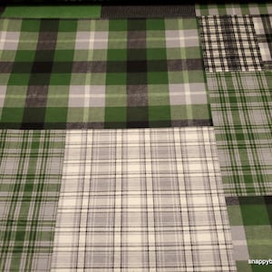 May include: A patchwork fabric with a variety of green, black, and white plaid patterns. The fabric is made of cotton and is perfect for quilting, sewing, and crafting.