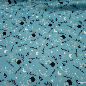 May include: A blue fabric with a repeating pattern of black cauldron, potion bottles, stars, moons, and the words "potions", "cauldron", "magic hat", "wand", and "little apprentice".