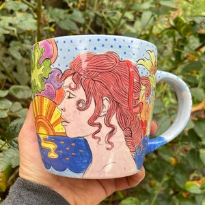 Hand painted ceramic cup with a seventies design