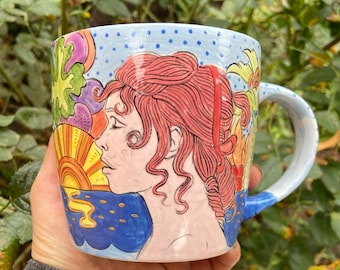 Hand painted ceramic cup with a seventies design