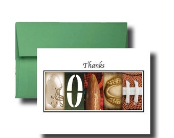 May include: A white greeting card with a green envelope featuring the word Thanks above the letters COACH. Each letter is formed by a football-themed image: a helmet, the letter O, a football, a mouthguard, and a textured football lace.