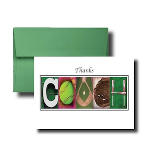 May include: A white greeting card with a green envelope featuring the word COACH spelled out using images of a white letter C, a yellow softball, a baseball diamond, a brown leather glove, and two pink bats forming the letter H, with Thanks above.