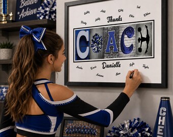 May include: A framed wall art print featuring the word COACH in large blue and black letters, with the letter O replaced by a blue and silver pom-pom. The print includes the text Thanks and Danielle, surrounded by various names, all set against a white background within a black frame.