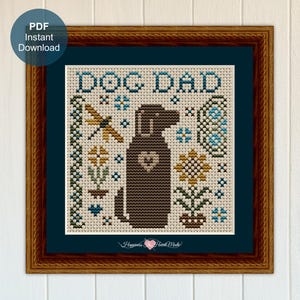 May include: Cross-stitch art in a wooden frame. The design features a brown dog with a heart, the words "DOG DAD", and floral and dragonfly accents. The words "PDF Instant Download" are in a blue circle in the upper left corner.