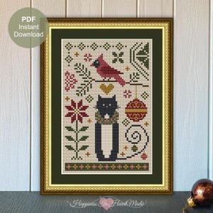 May include: Cross stitch pattern featuring a black cat wearing a green scarf and a red cardinal perched on a branch. The design includes poinsettia flowers, ornaments, and other festive elements. The pattern is framed in a gold frame.