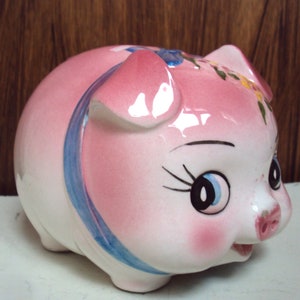 Tirelire en céramique datant des années 1970 représentant un petit cochon.