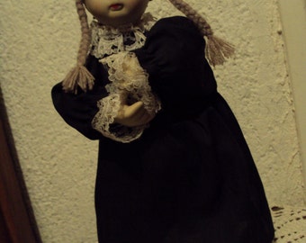Automaton, doll with black dress and lace.