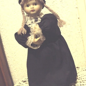 Automaton, doll with black dress and lace.
