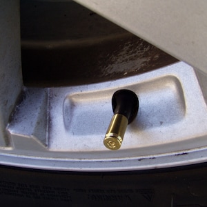 Real Brass bullet valve stem caps.