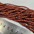 Goldstone 4mm Polished Round Man Made Stone Bead Strand product logo