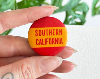 Vintage 1960s Southern California University Los Angeles college football sports pinback button pin red orange 1.25"