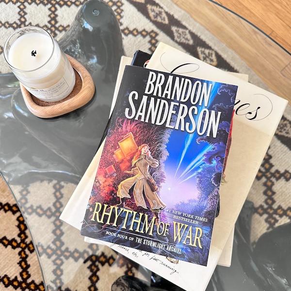 Brandon Sanderson Rhythm of War book 4 Stormlight Archive paperback TOR First Trade Paperback Edition with fold out map fantasy series