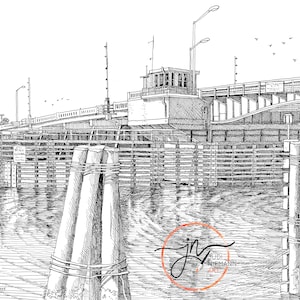 May include: Black and white pen and ink drawing of a bridge over a body of water. The bridge is a drawbridge with a wooden structure and a metal railing. The water is calm and reflective. The drawing is signed "Judi Niemann Art" in the lower right corner.