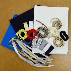 Anti-Abfallkorb „Fusion“ K – Baumwoll-Popeline-Stoff (3 Gutscheine), Schrägband und Paspeln aus Baumwolle, Satin, Lurex, Kunstleder, elastisch...