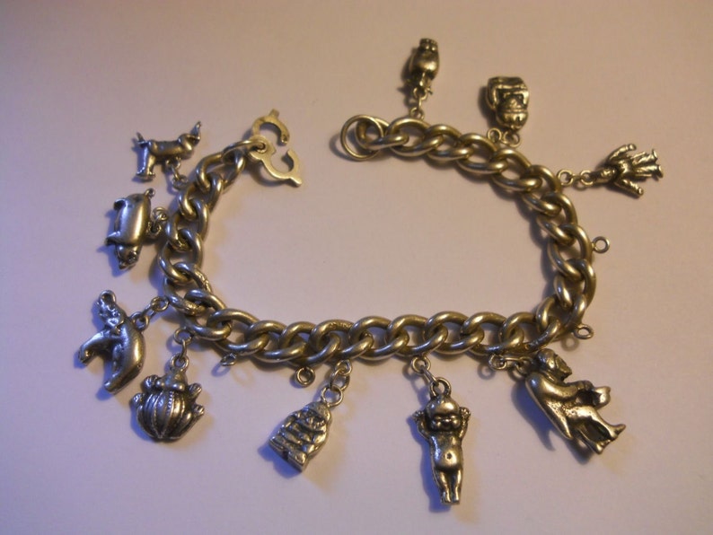 Silver Charm Bracelet 0.900 Vintage Heavy and Solid old world traveler charm bracelet elephant more charms Kewpie Unusual Clasp frog