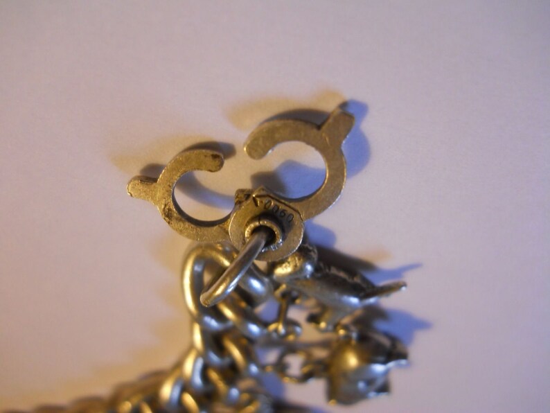 Silver Charm Bracelet 0.900 Vintage Heavy and Solid old world traveler charm bracelet elephant more charms Kewpie Unusual Clasp frog