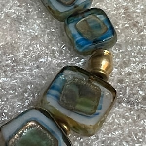 SKY CLOUDS BRACELET:  Aqua beds and brass;  casual or party style;  delicately unique; funky and stylish.