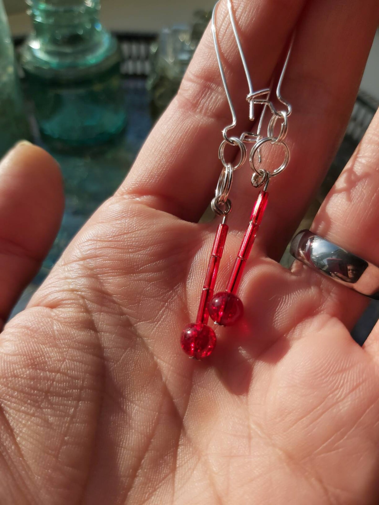 Blood drop earrings. Red beads hung on wires that fit through Etsy