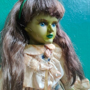 Ooak porcelain doll repaint. Witch with stand