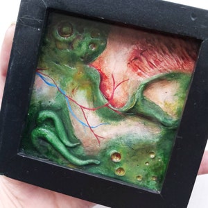 Small frame of sculpted nastiness. Dark art, gothic decor. Horror decor