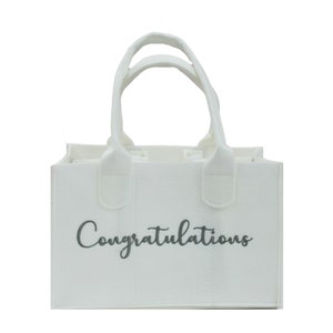 May include: White felt tote bag with two handles and the word "Congratulations" printed in gray on the front.