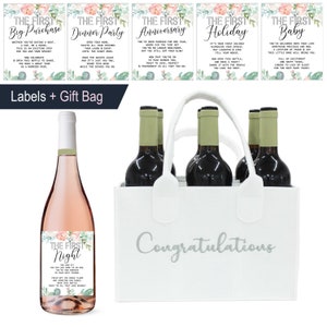 May include: A white gift bag with the word "Congratulations" printed in silver lettering. The bag is filled with six bottles of wine. There are five labels on the bottles, each with a different floral design and text. The labels read "The First Big Purchase", "The First Dinner Party", "The First Anniversary", "The First Holiday", "The First Baby", and "The First Night".