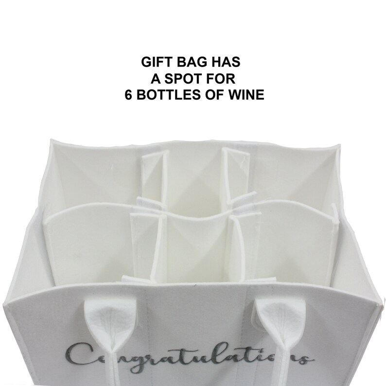 May include: White felt gift bag with six individual compartments for wine bottles. The bag has two handles and the word "Congratulations" printed on the front.