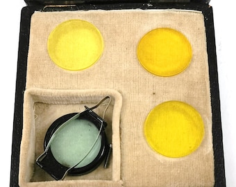 Vintage fotografie, cameralenzen, gekleurde lenzen, gele tint, 25 mm lens, cased lenzen, fotografie apparatuur, retro home, traditioneel