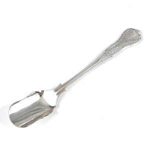 May include: A silver-toned metal spoon featuring a wide, flat bowl and a slender handle. The handle is decorated with an embossed shell motif at the top and intricate scrollwork detailing along the stem, providing a polished and reflective finish.