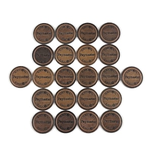 May include: A collection of twenty-four round, wooden tokens with the text "Paymaster" and "Eurocoin" printed on them. The tokens are arranged in a grid pattern against a white background.