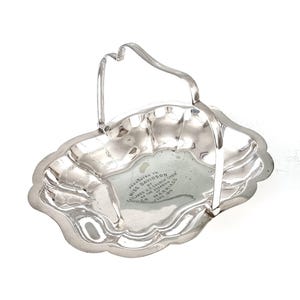May include: Silver serving tray with a handle, presented to Miss Davidson by the Datlands U.F. Church Choir on the occasion of her marriage, June 1919.