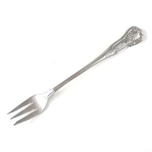 May include: A silver fork with three prongs, featuring an ornate handle with a shell and floral design. The fork is made of a shiny, reflective metal and is set against a white background. This elegant utensil is suitable for formal dining.
