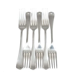 May include: Six silver forks with heart-shaped handles are displayed against a white backdrop. Each fork has four tines and a polished finish, ideal for formal dining. The forks are made of metal.