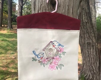 Bird House Clothes Pin Bag embroidered with Blue Birds hanging laundry.