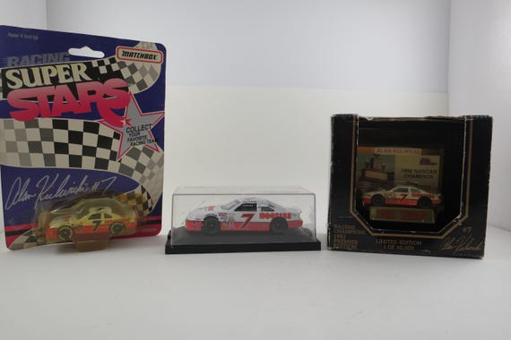 Set of Three  NASCAR Alan Kulwicki #7 Die Cast Cars New In Package Hooters Livery 1:43/64 Scale