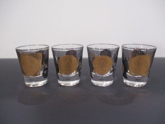 Set of Four Rare Vintage Shot Glasses Black 22K Gold Old World Coin 1866-1915 Excellent Original Condition