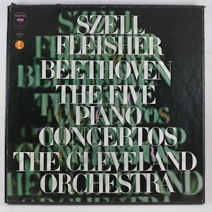 May include: A vintage vinyl record album with a black cover featuring white text. The album title is "Beethoven The Five Piano Concertos" performed by The Cleveland Orchestra, with the names Szell and Fleisher also visible.
