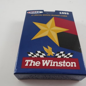 May include: A blue box of 1993 Winston 51 Special Edition trading cards. The box features a gold star, a red and black stripe, and the words "The Winston" in white on a red background. The box also has a checkered flag design.