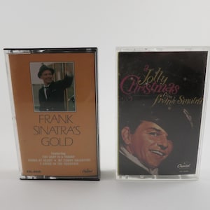May include: Two cassette tapes, one with a picture of Frank Sinatra on the cover and the title "Frank Sinatra's Gold", the other with a picture of Frank Sinatra on the cover and the title "A Jolly Christmas from Frank Sinatra".
